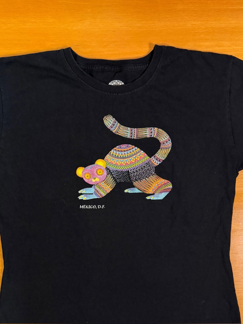 MEXICANA Black Tee with Multicolor Folk Art Animal